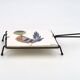 Square ceramic trivet with a bird by Jean Pierre Caffarelli.