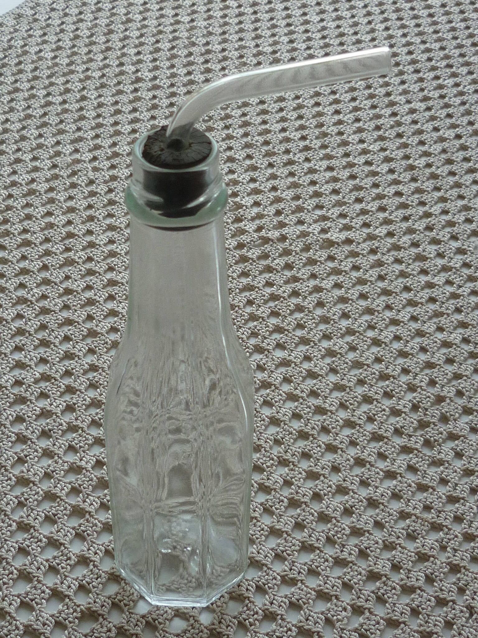 Old bottle with glass pipette