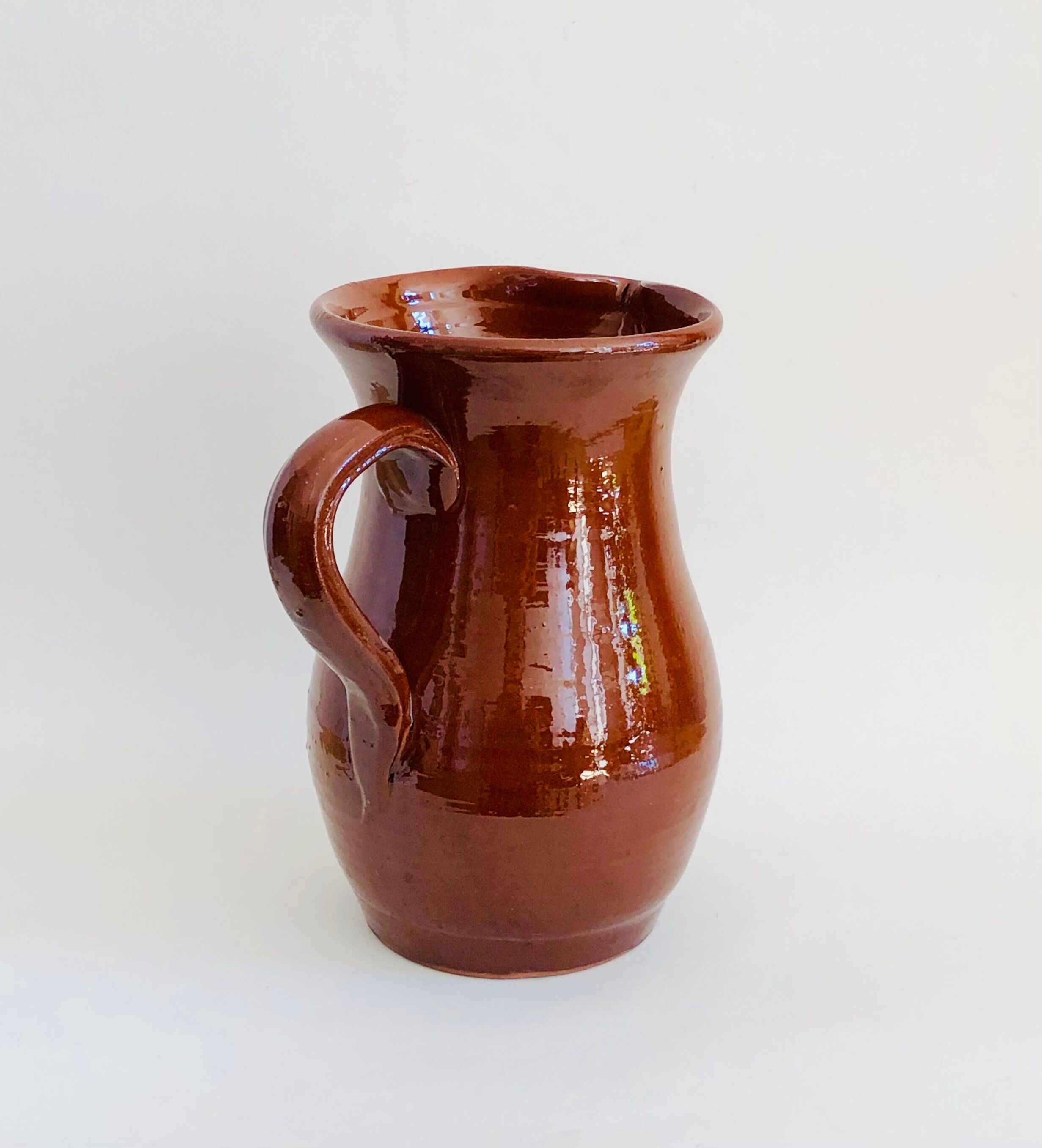 Vintage pitcher in glazed earth