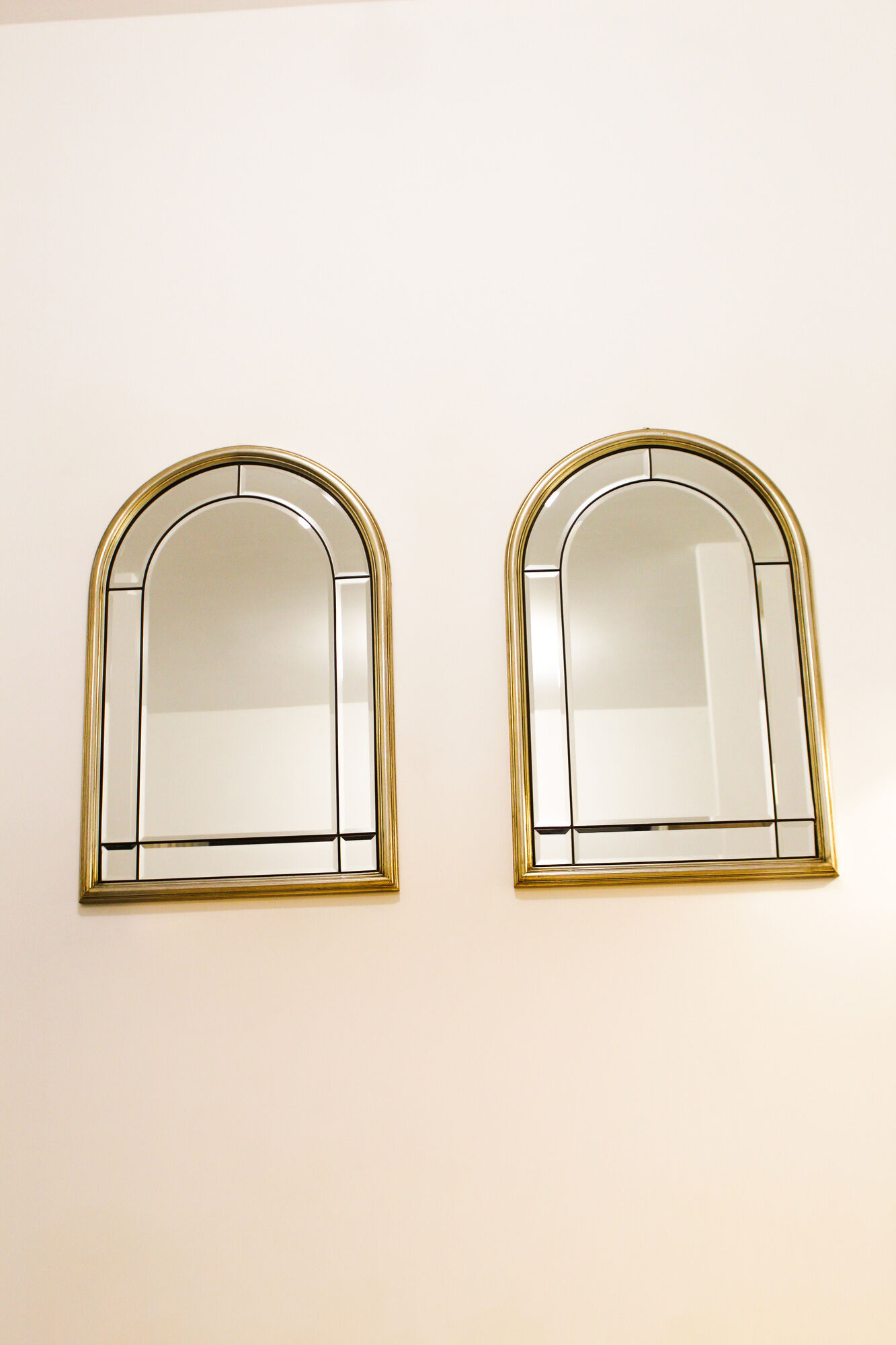 Pair of bevelled mirrors, brass edging frame in brushed wood years Italy 70's