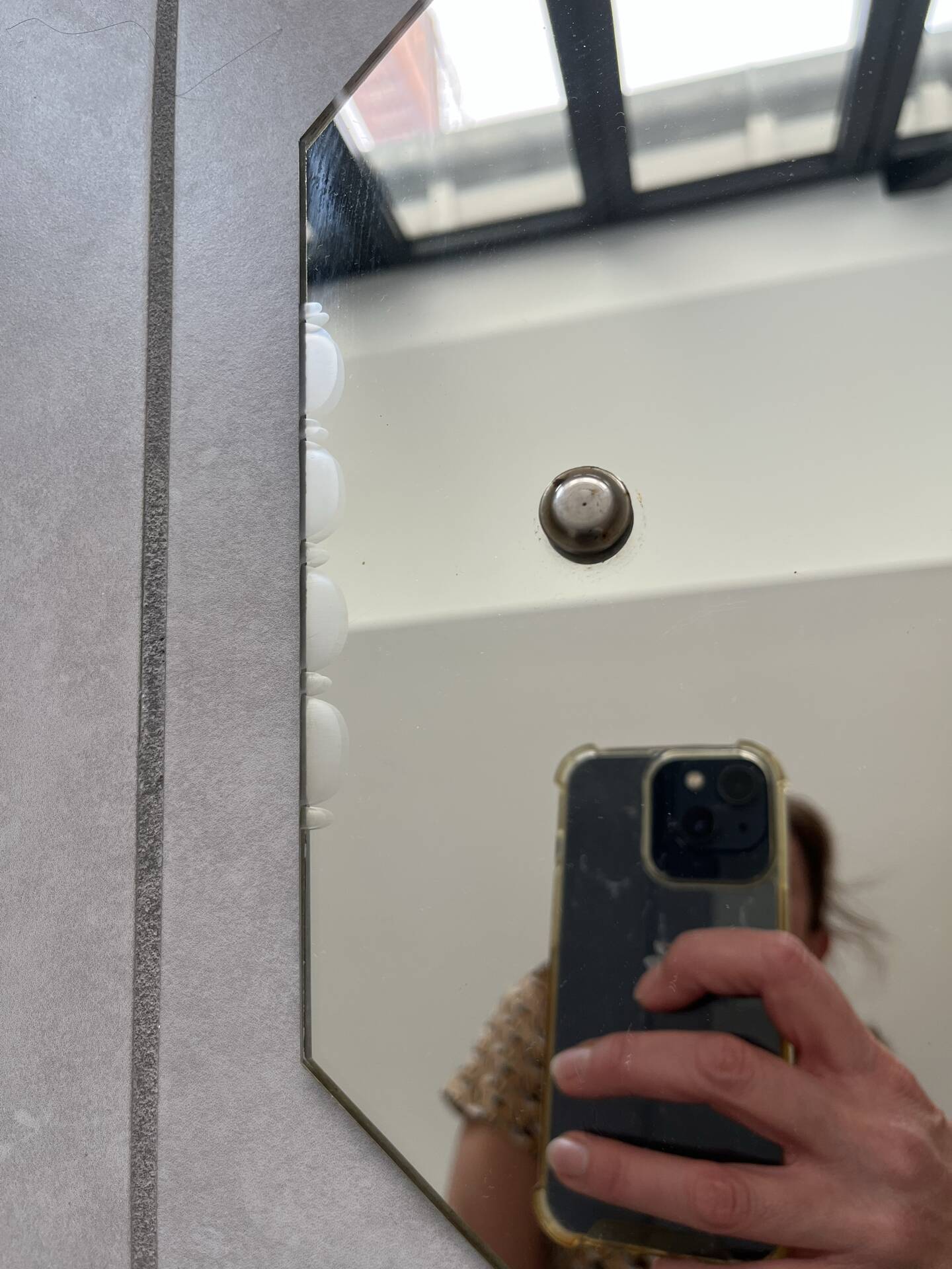 Small bevelled wall mirror from the 1940s.