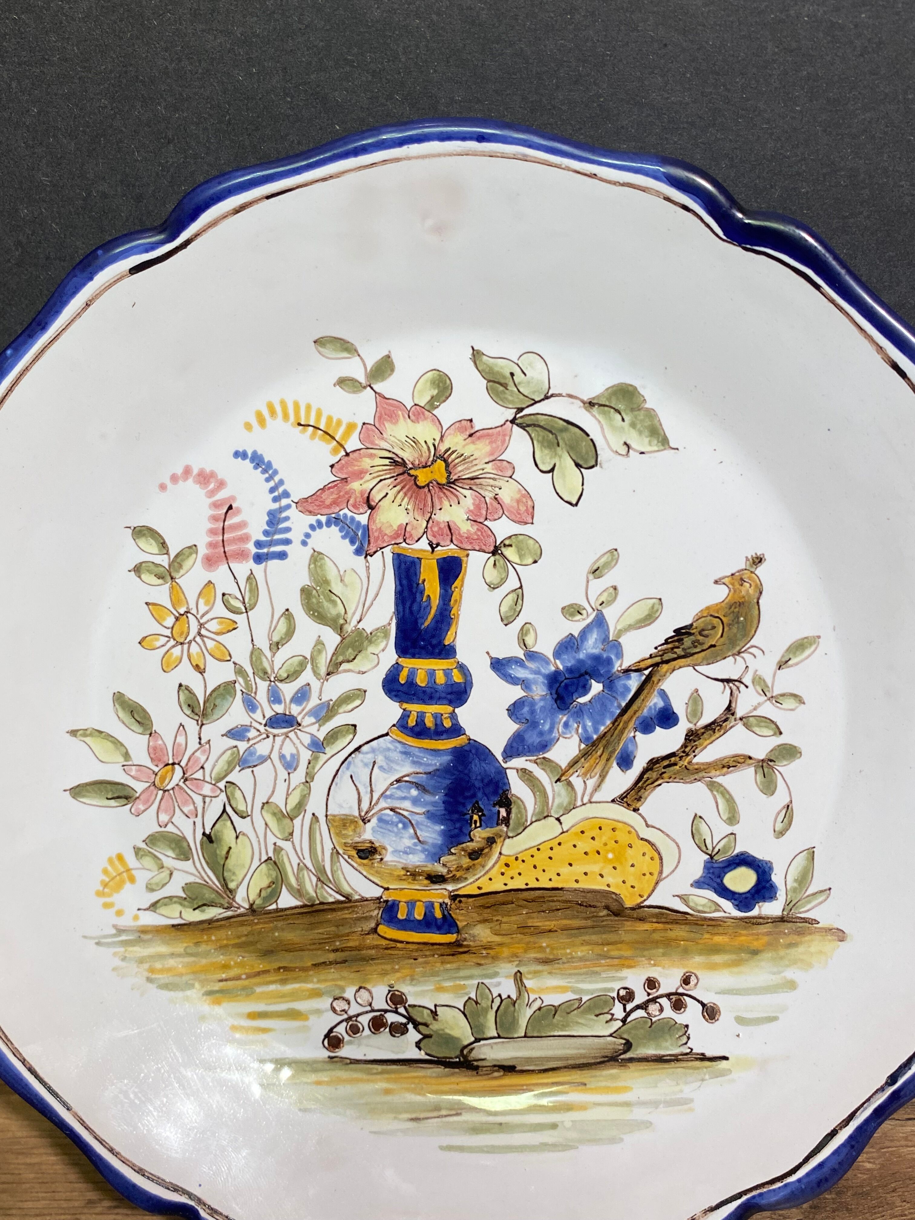 Pair of Nevers earthenware plates signed Georges