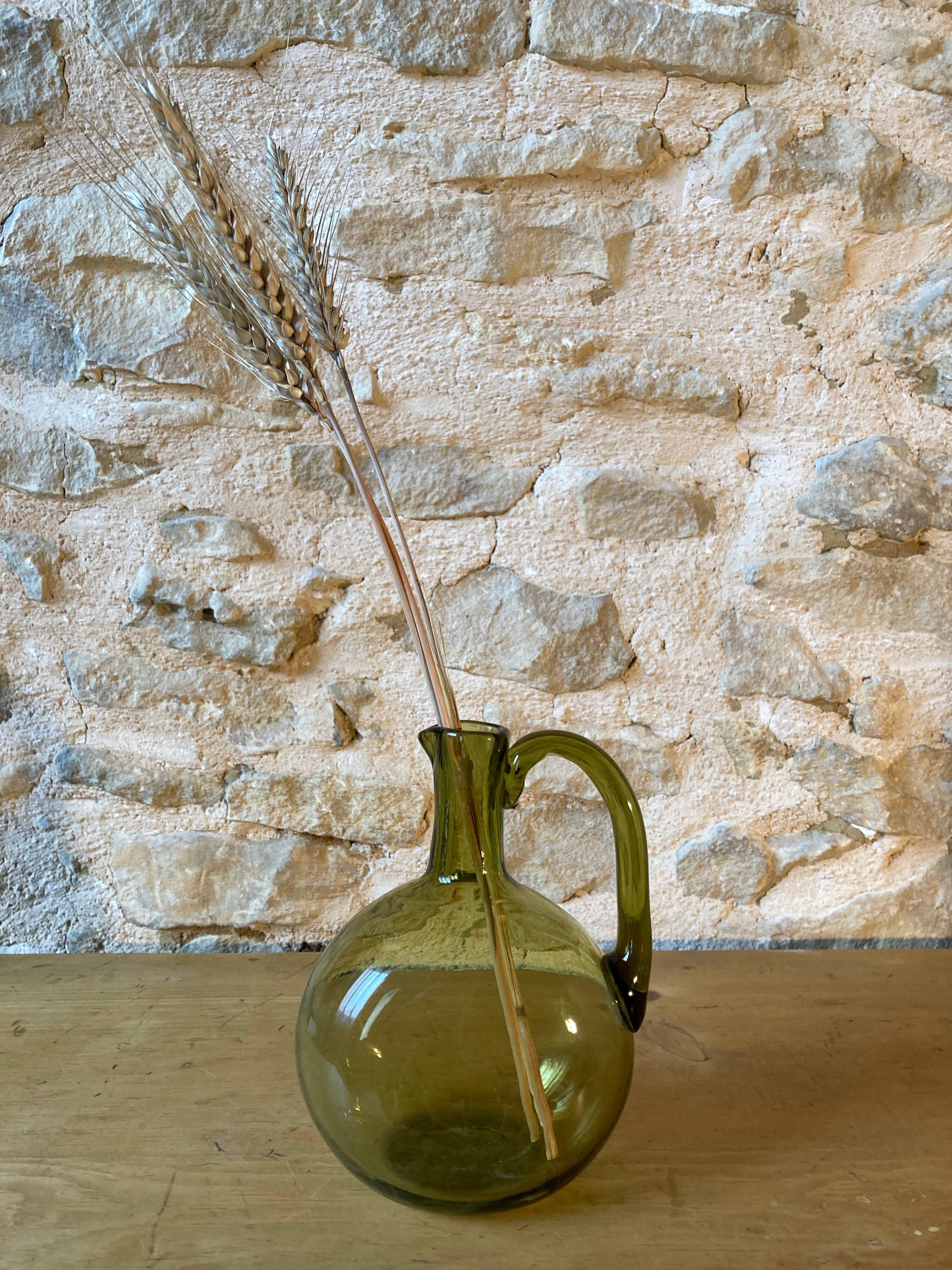 Green blown glass carafe