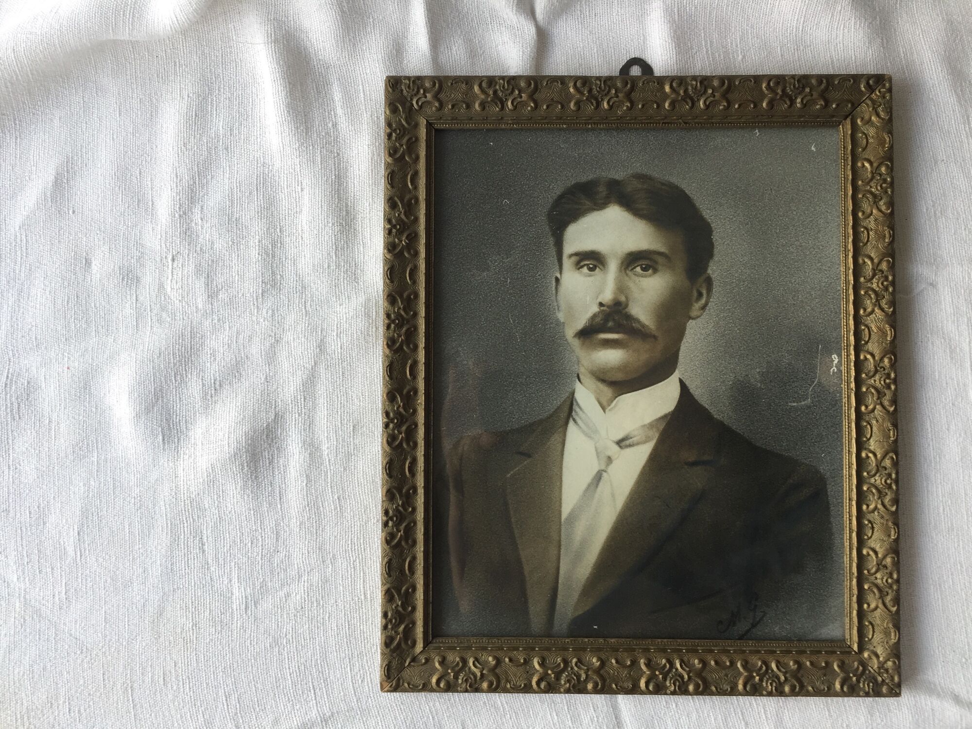 Authentic old photograph portrait of a handsome man with mustache 1920 - 1930