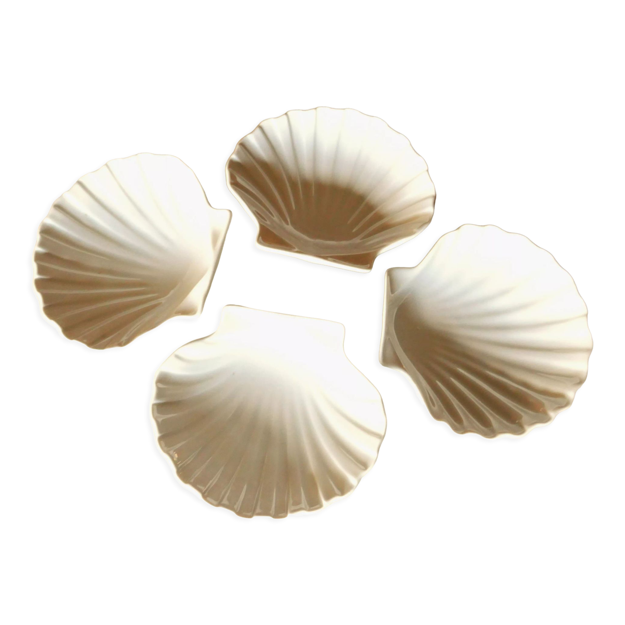 4 antique cups in the shape of a white porcelain shell