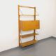 Wall shelf library with vintage light wood secretary bar