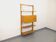 Wall shelf library with vintage light wood secretary bar