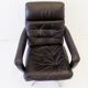 Danish black leather armchair with ottoman 70s