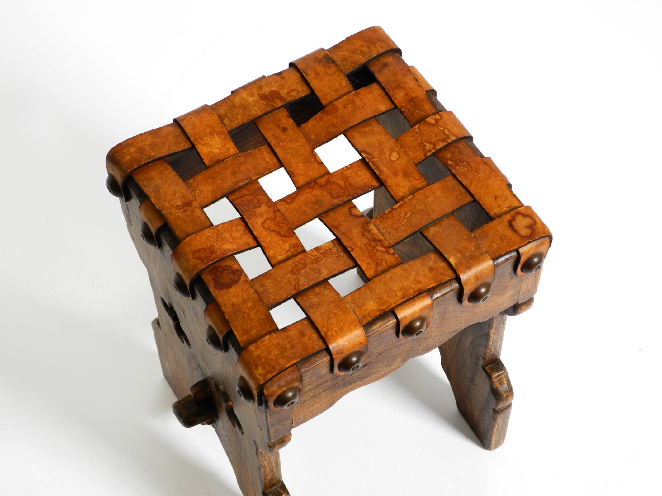 Beautiful 1940s oak stool with a seat made of leather straps
