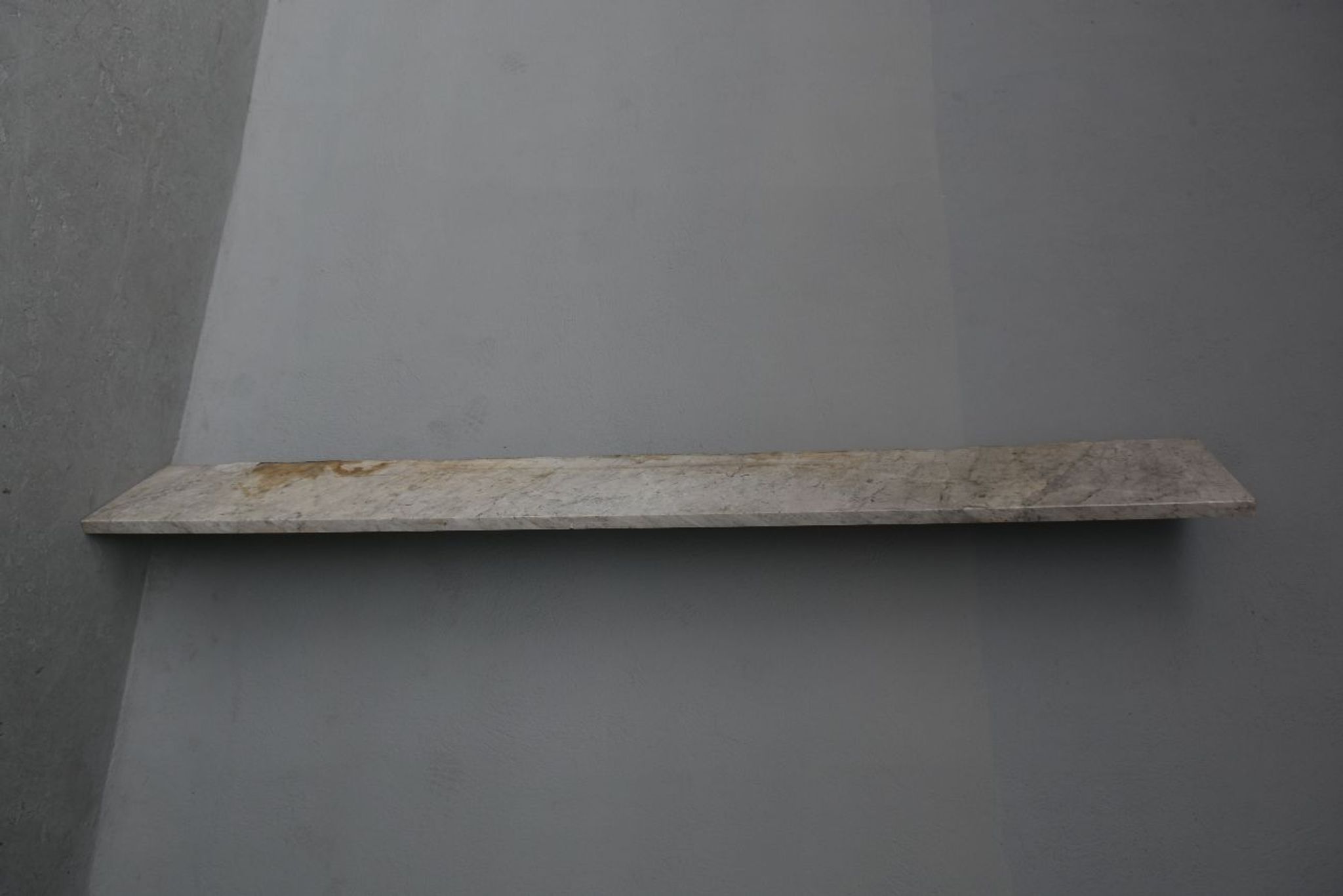 Old fireplace in white marble veined Louis XVI