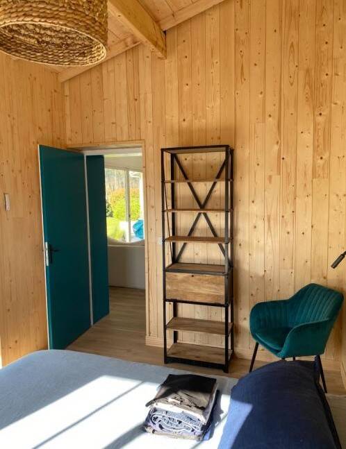 Industrial shelf made of solid exotic mango wood with riveted metal.