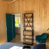 Industrial shelf made of solid exotic mango wood with riveted metal.