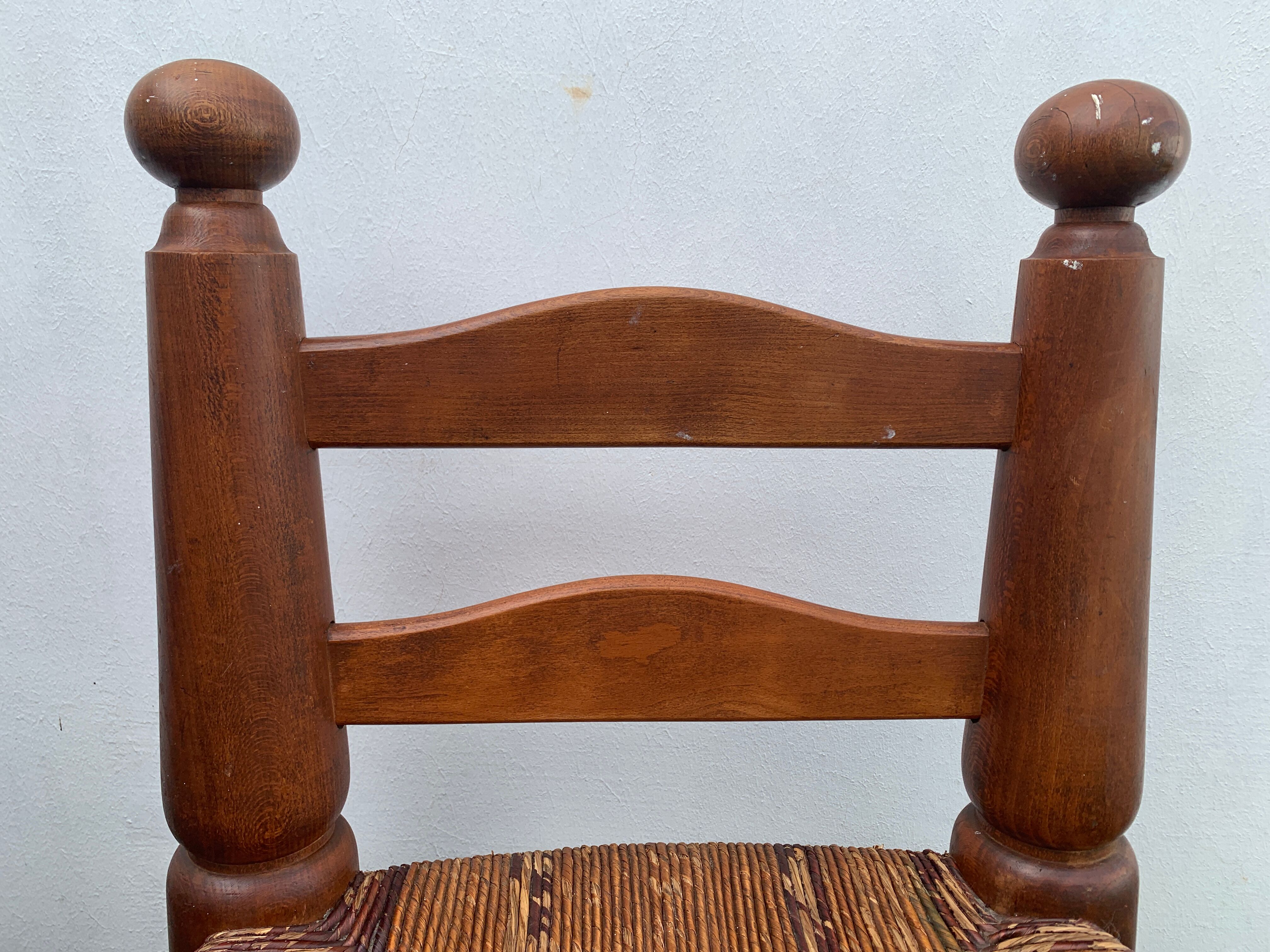Pair of antique low fire chairs made of wood and straw
