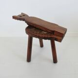 Brutalist cowhide tripod stool in solid wood