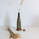 Glass and wicker bottle