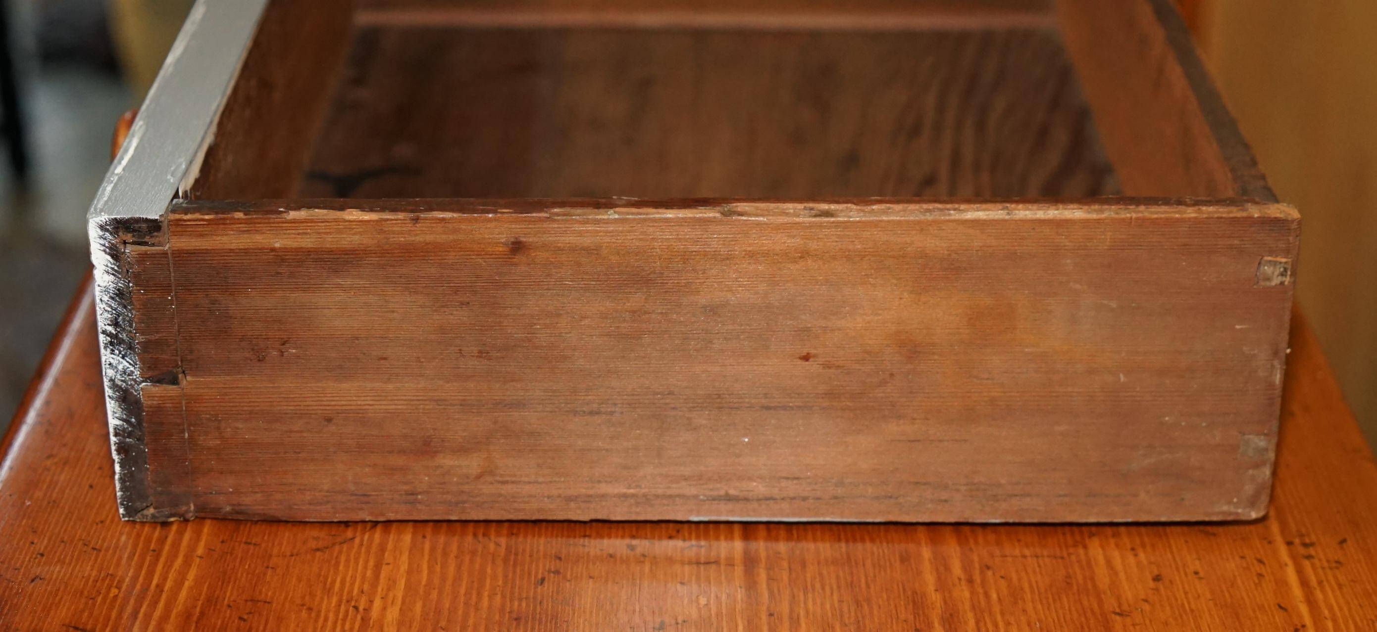 Vintage wooden furniture for 45 wine bottles with a drawer.