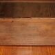 Vintage wooden furniture for 45 wine bottles with a drawer.