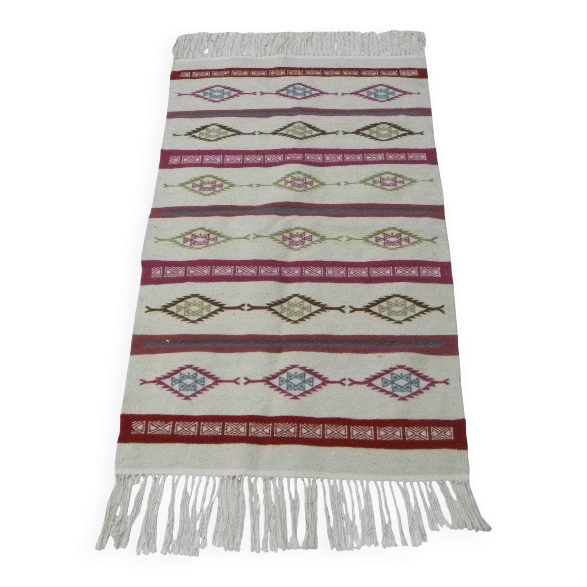 Tribal bohemian kilim rug with geometric pattern in wool.