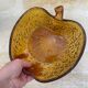 Amber glass dessert service in the shape of an apple made in Italy.