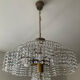 Vintage lucite chandelier with a cascade of crystal pendants from the 1970s.