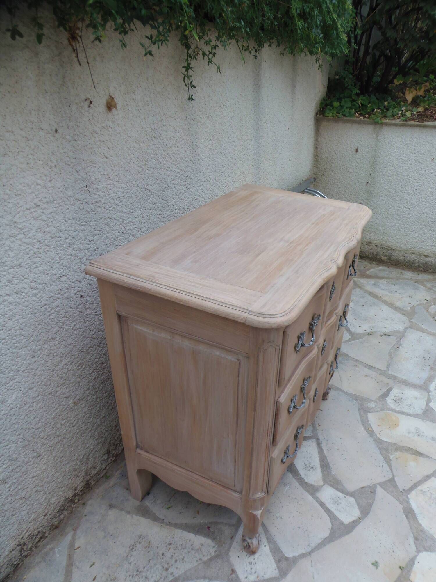 Beautifully crafted Louis XVI style commode in bleached wood.