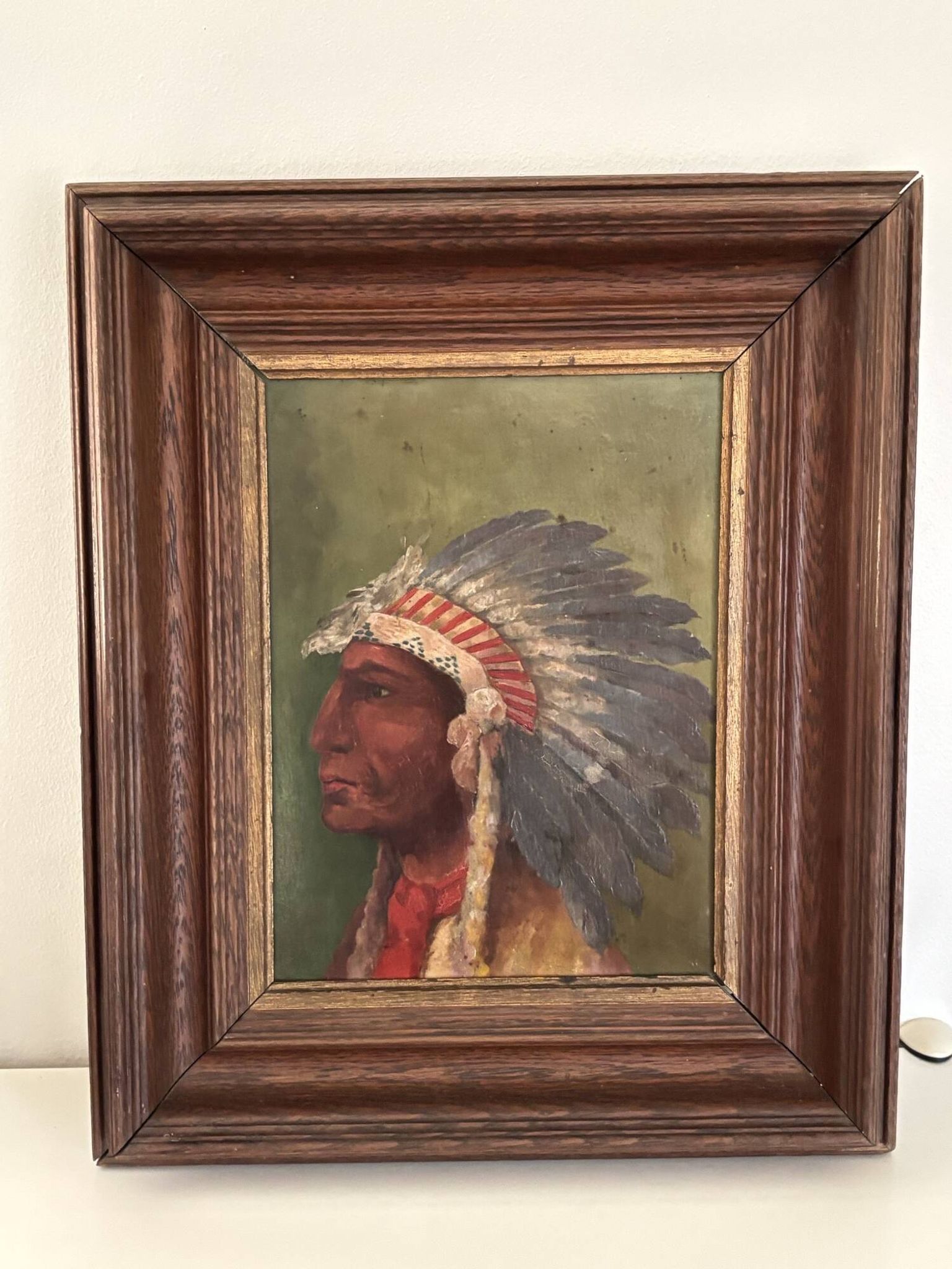 Old oil painting on panel of a Native American chief from the 19th century Wild West.