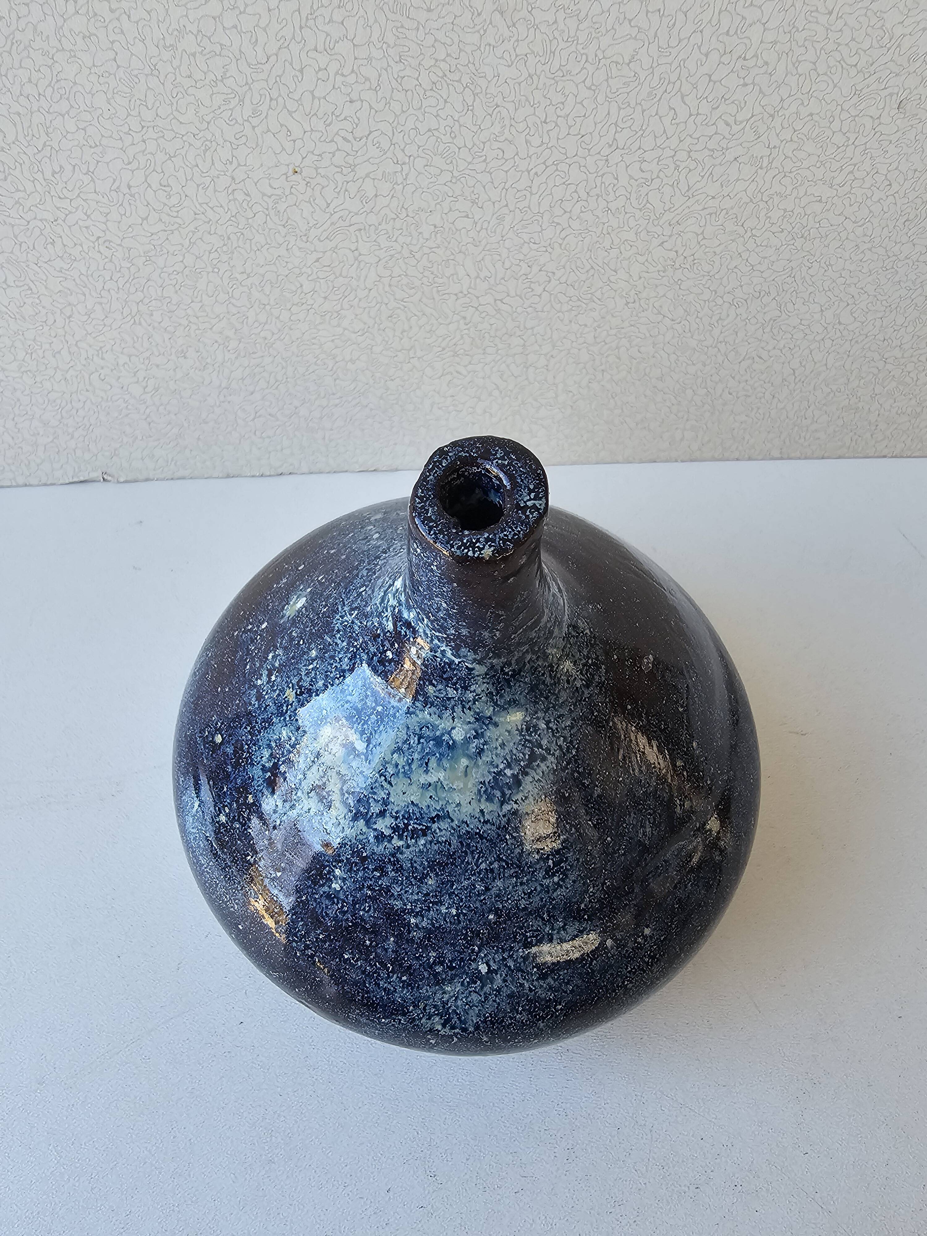 Small blue soliflore vase in glazed ceramic signed X (to be identified)