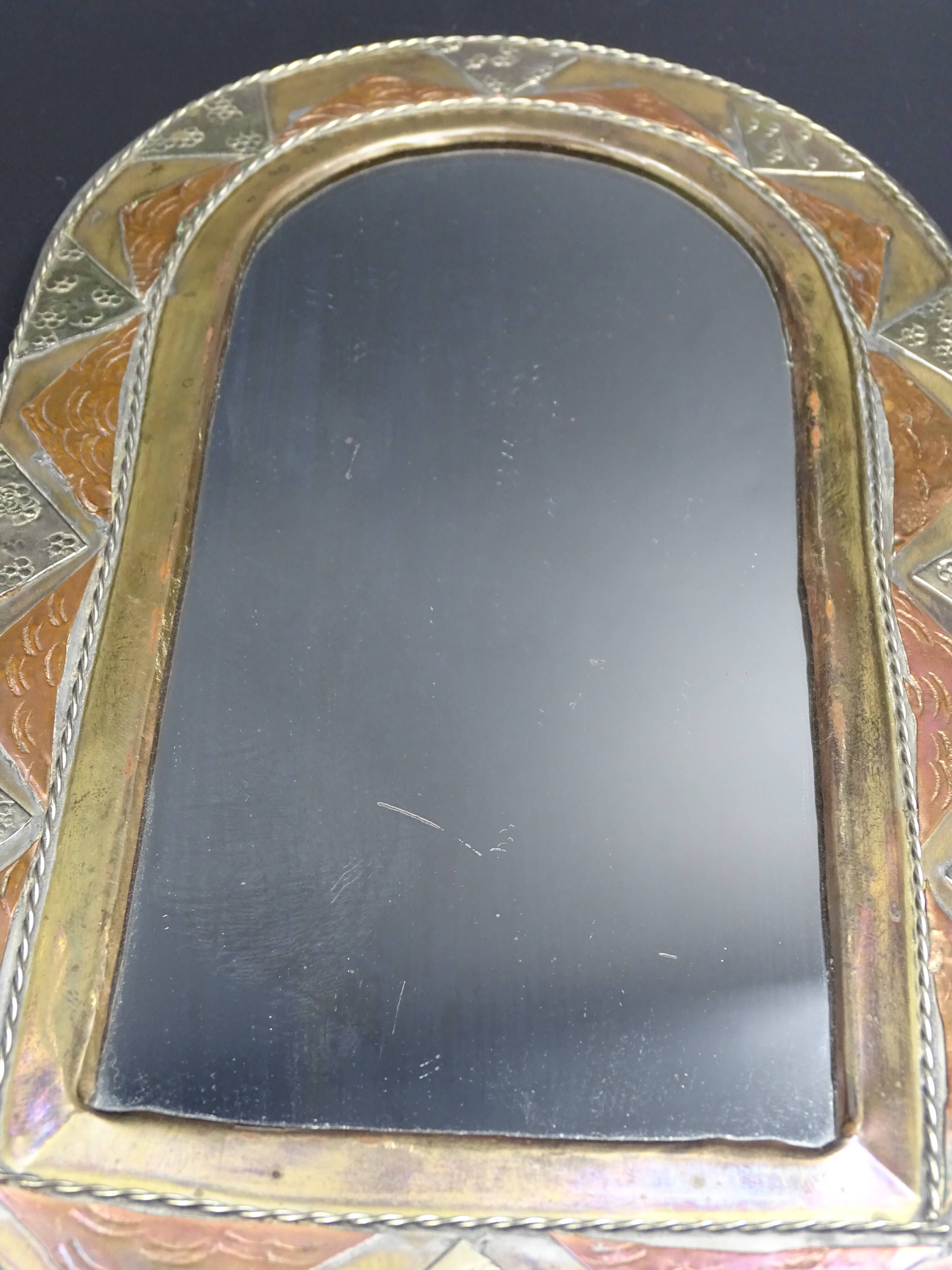 Oriental mirror in worked copper 24x15cm