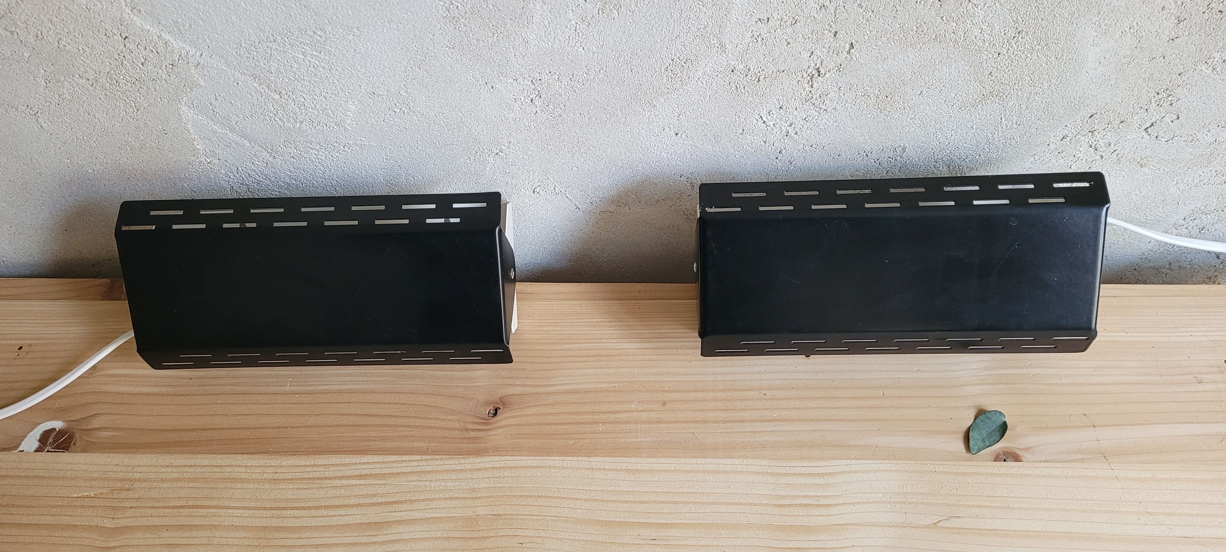 Pair of wall sconces with adjustable shutter