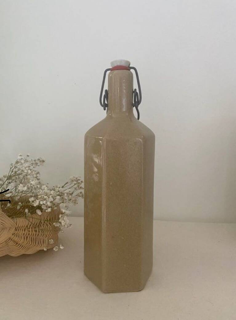 Old enameled stoneware bottle