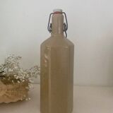 Old enameled stoneware bottle