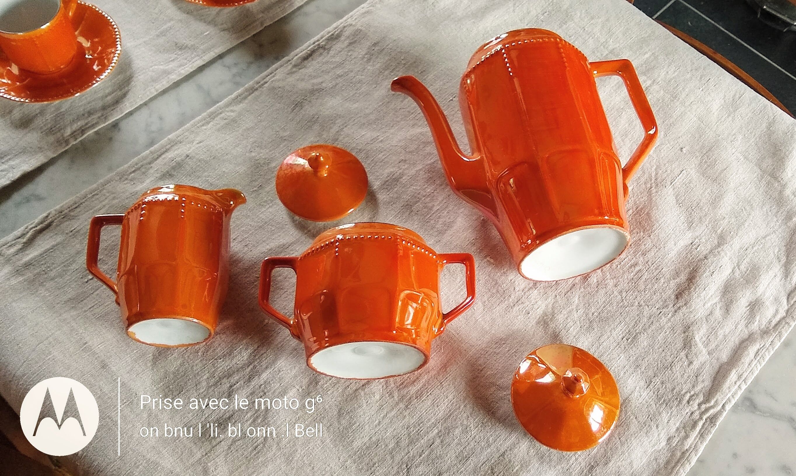 Iridescent orange porcelain coffee set from the 50s-60s with black edging