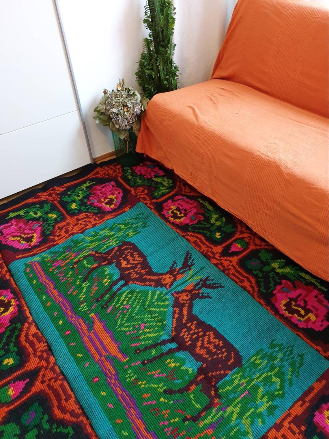 Vintage Romanian rug with deers, nature scenery on a floral background