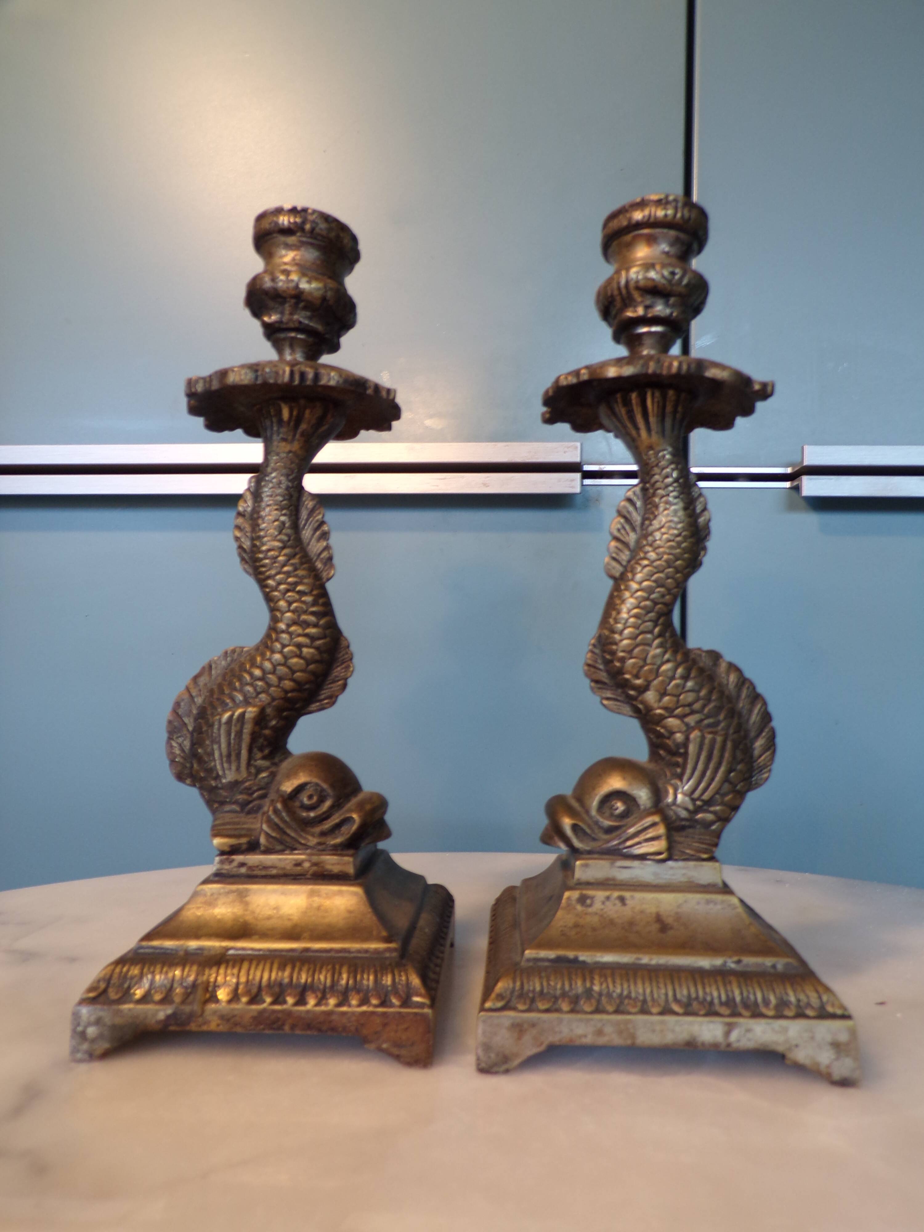 Pair of bronze dolphin candlesticks