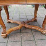 Napoleon III period walnut table from the late 19th century with extensions for 16 covers.