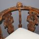 19th century walnut corner armchair with carved angel decoration