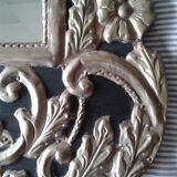 Mirror with embossed metal décor