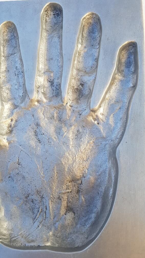 Trinket bowl hand print in 1970s aluminum