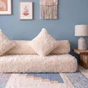 White Moroccan Arabic sofa with a rounded backrest.
