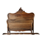 Antique double bed in carved solid wood in Louis XV style.