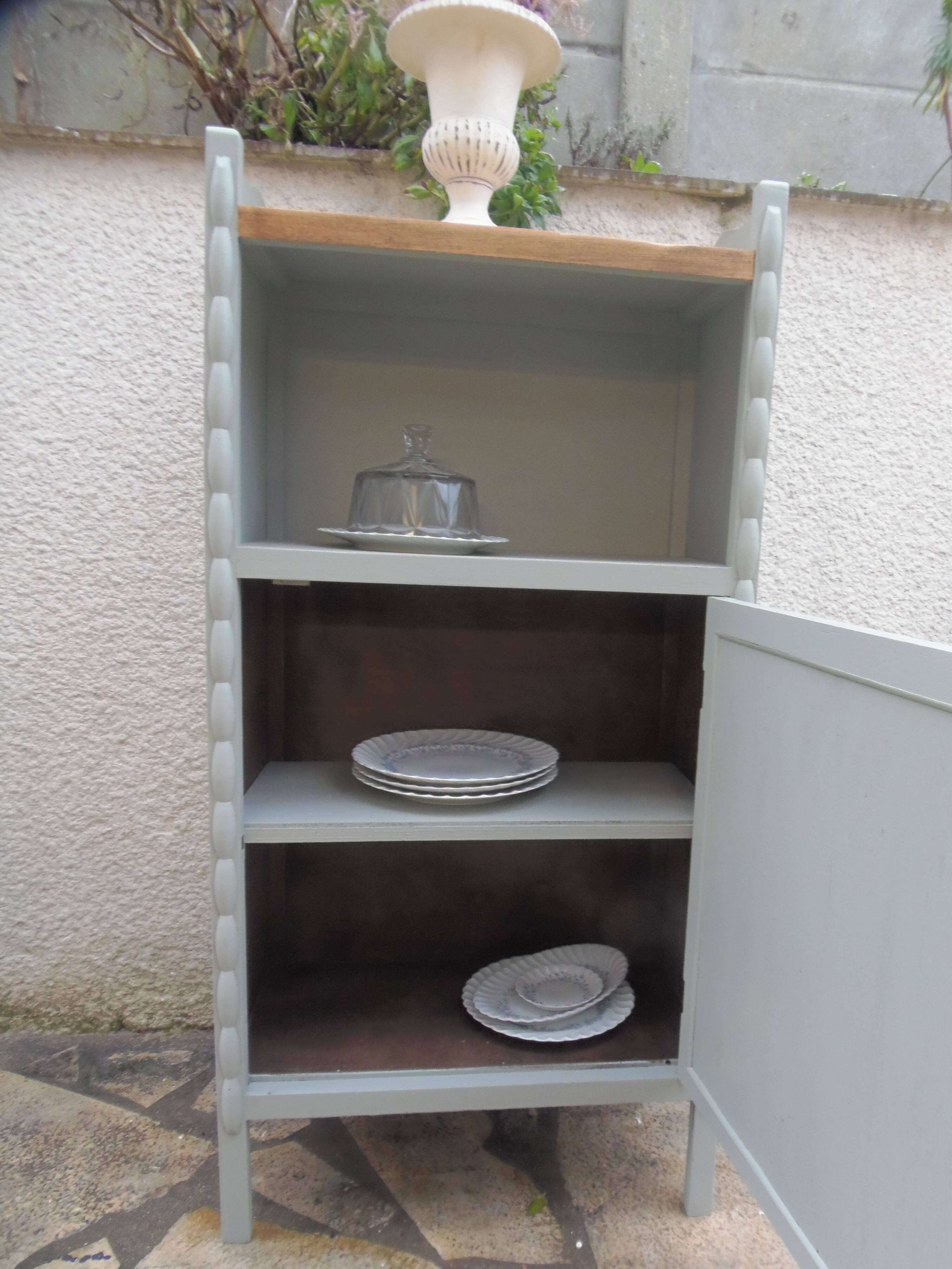 Vintage furniture of shallow depth re-enchanted in grey-green.