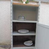 Vintage furniture of shallow depth re-enchanted in grey-green.