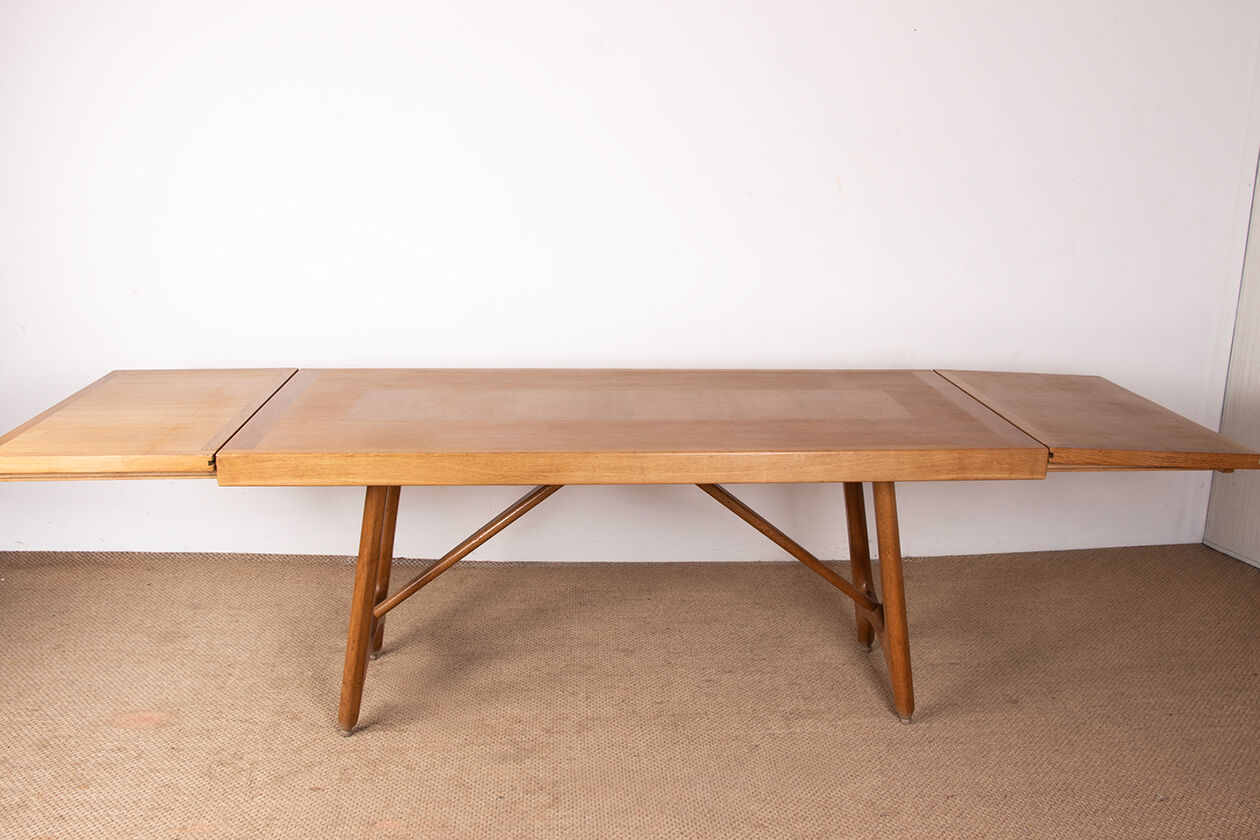 Large extendable dining table in oak by Guillerme and Chambron 1960.