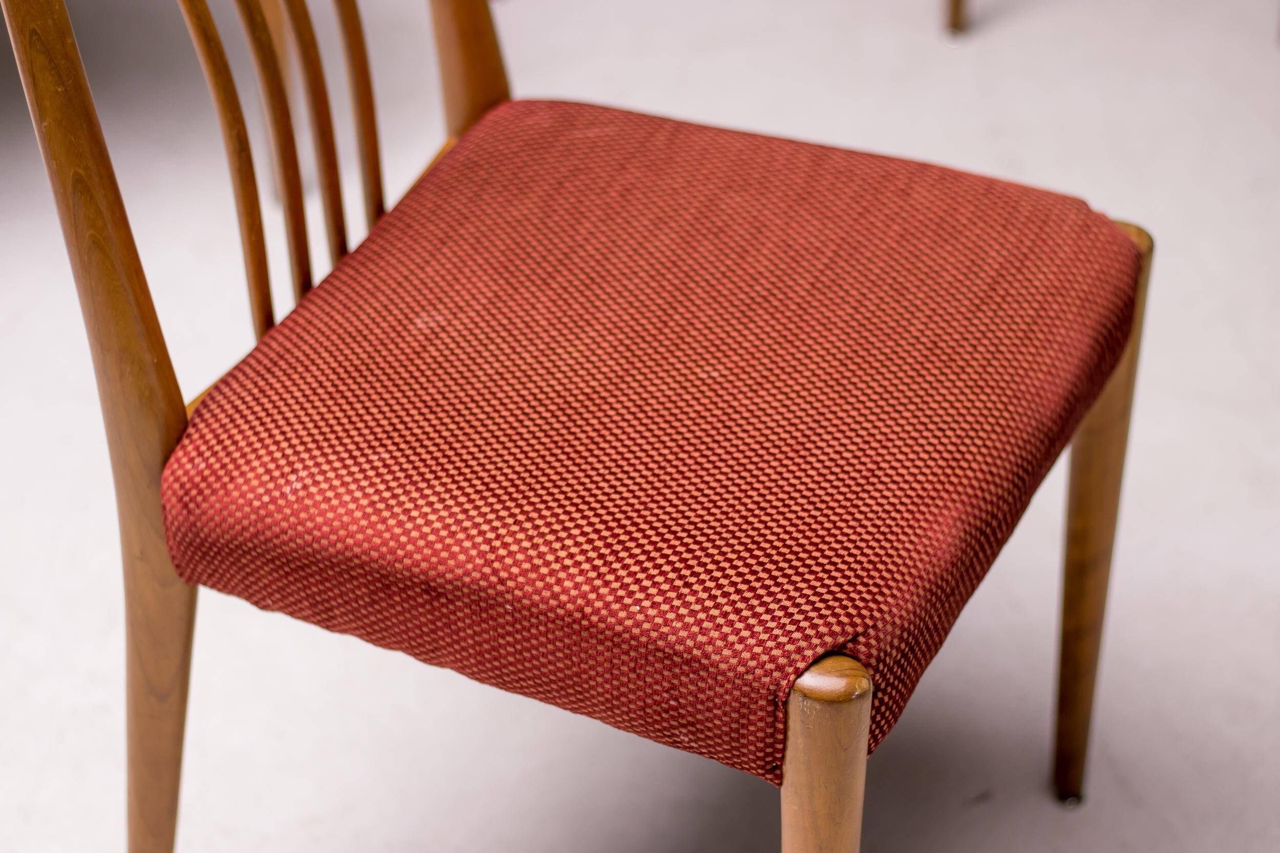 Set of six carved walnut dining chairs, Italy, 1955