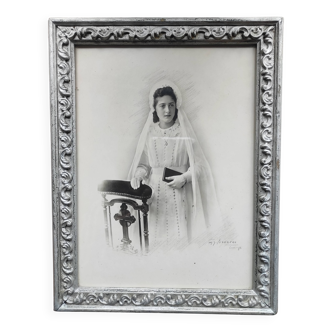 Antique photo frame with a young bride from the early 20th century