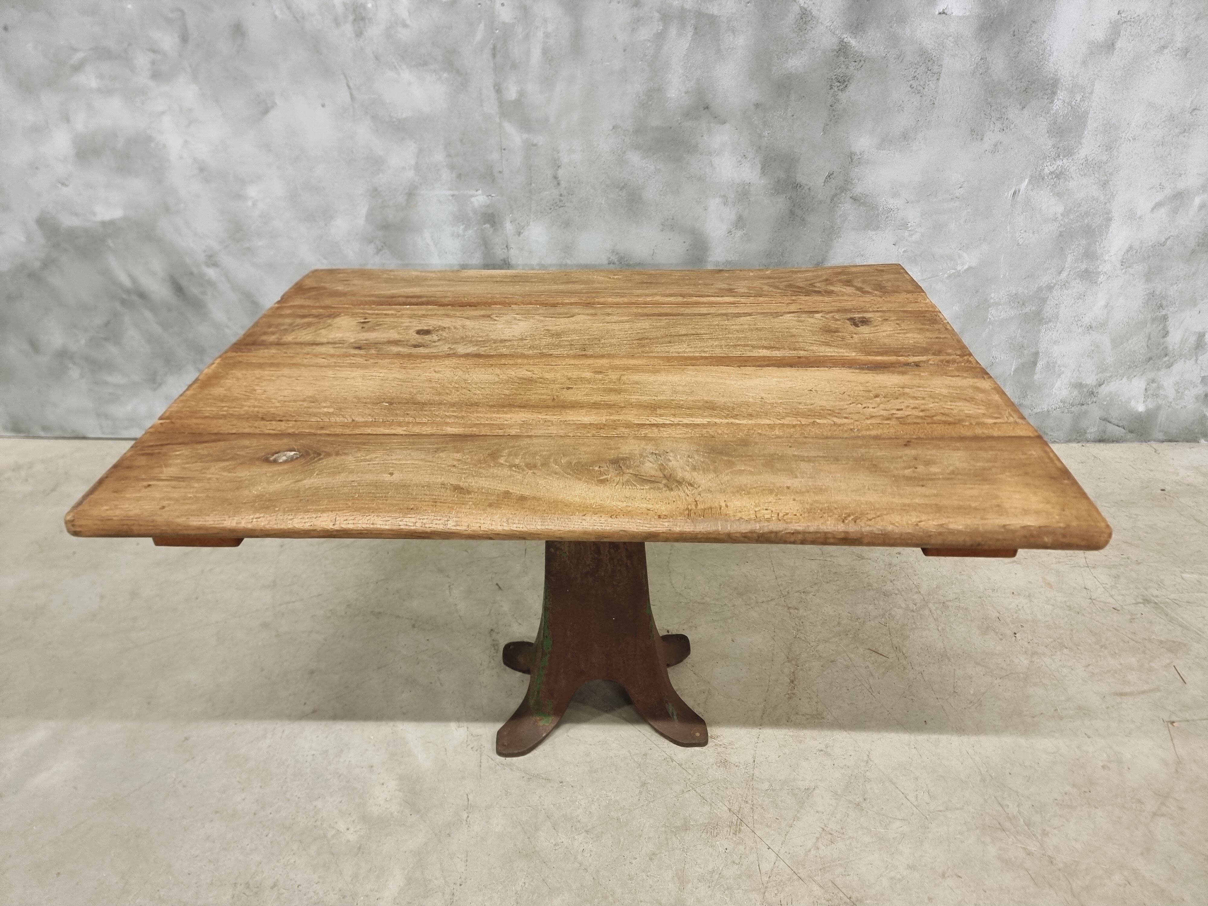 Antique oak dining table on cast iron base 93 x 123 cm
