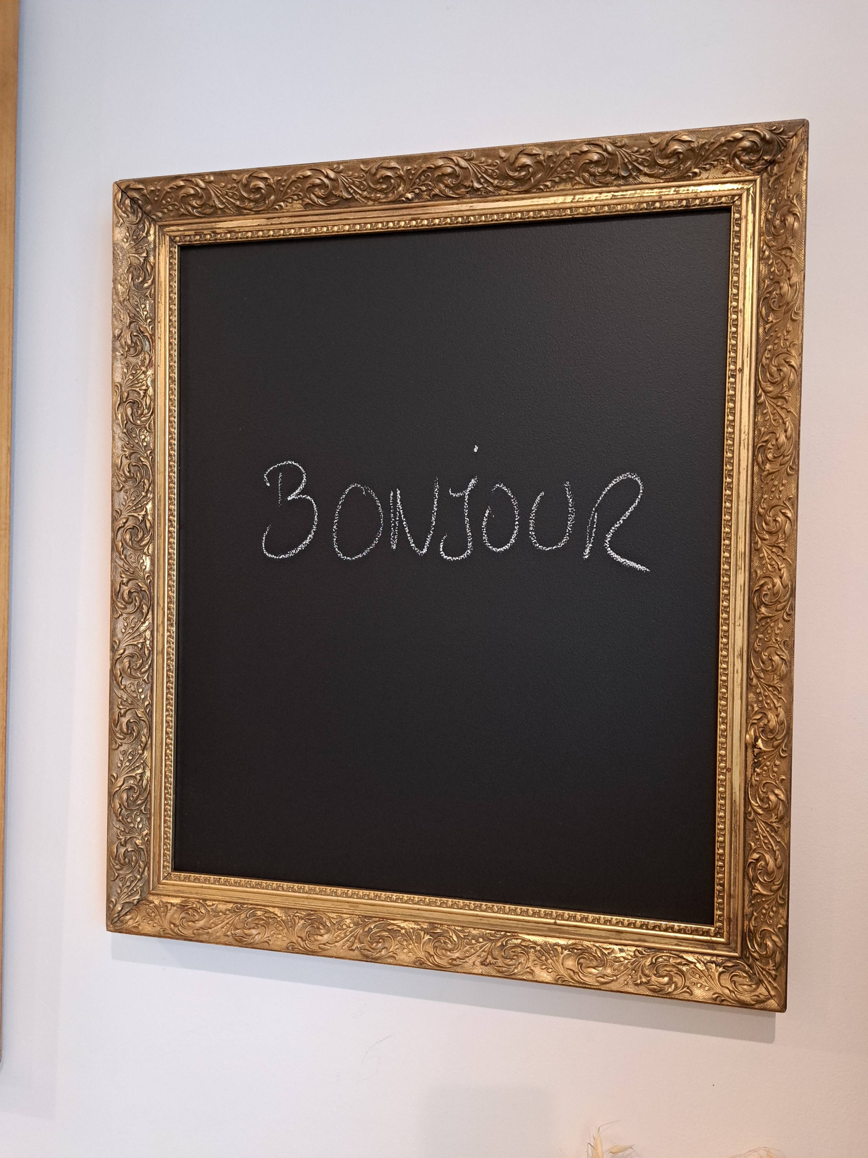 Slate table framed in gold leaf style