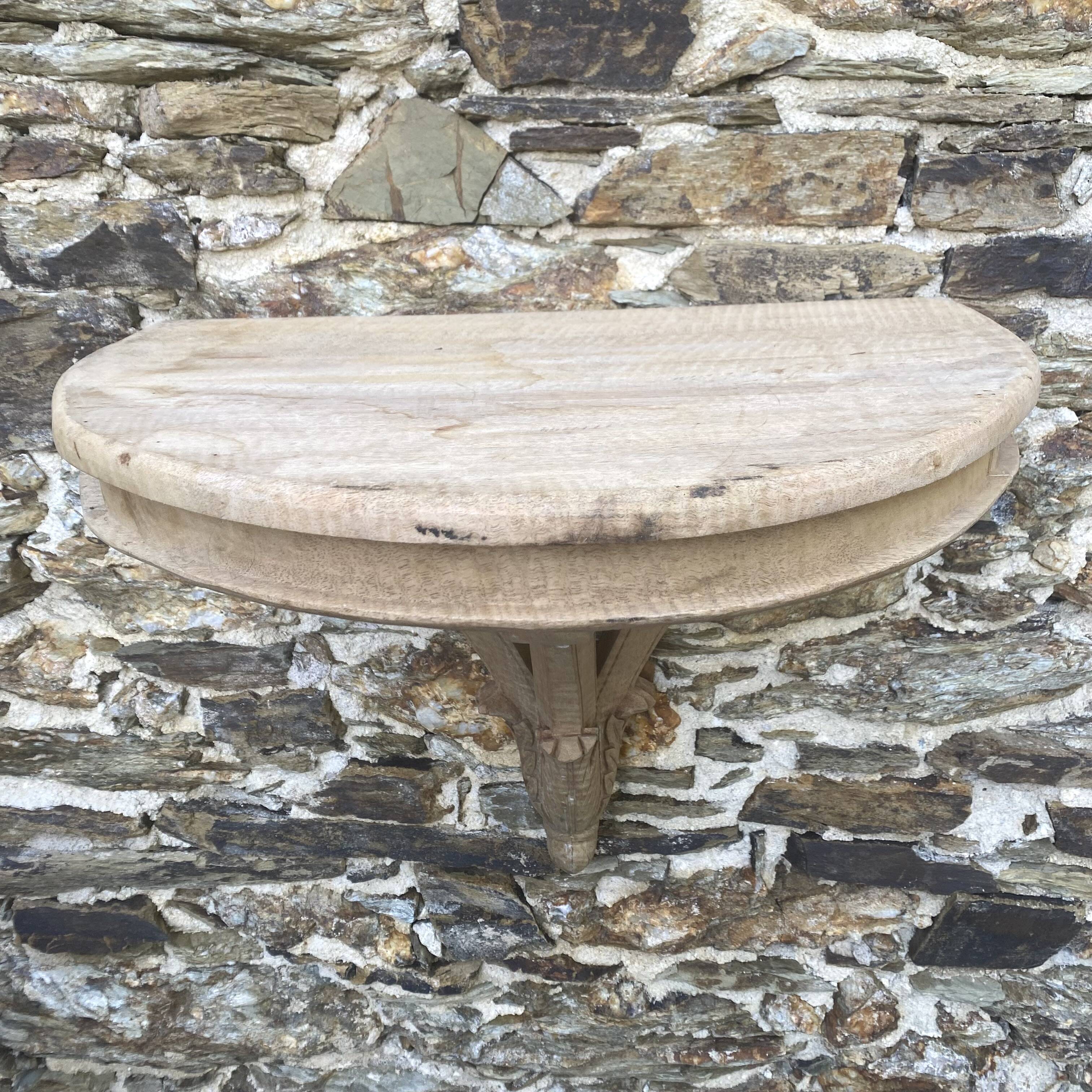 carved wooden wall shelf or wall console