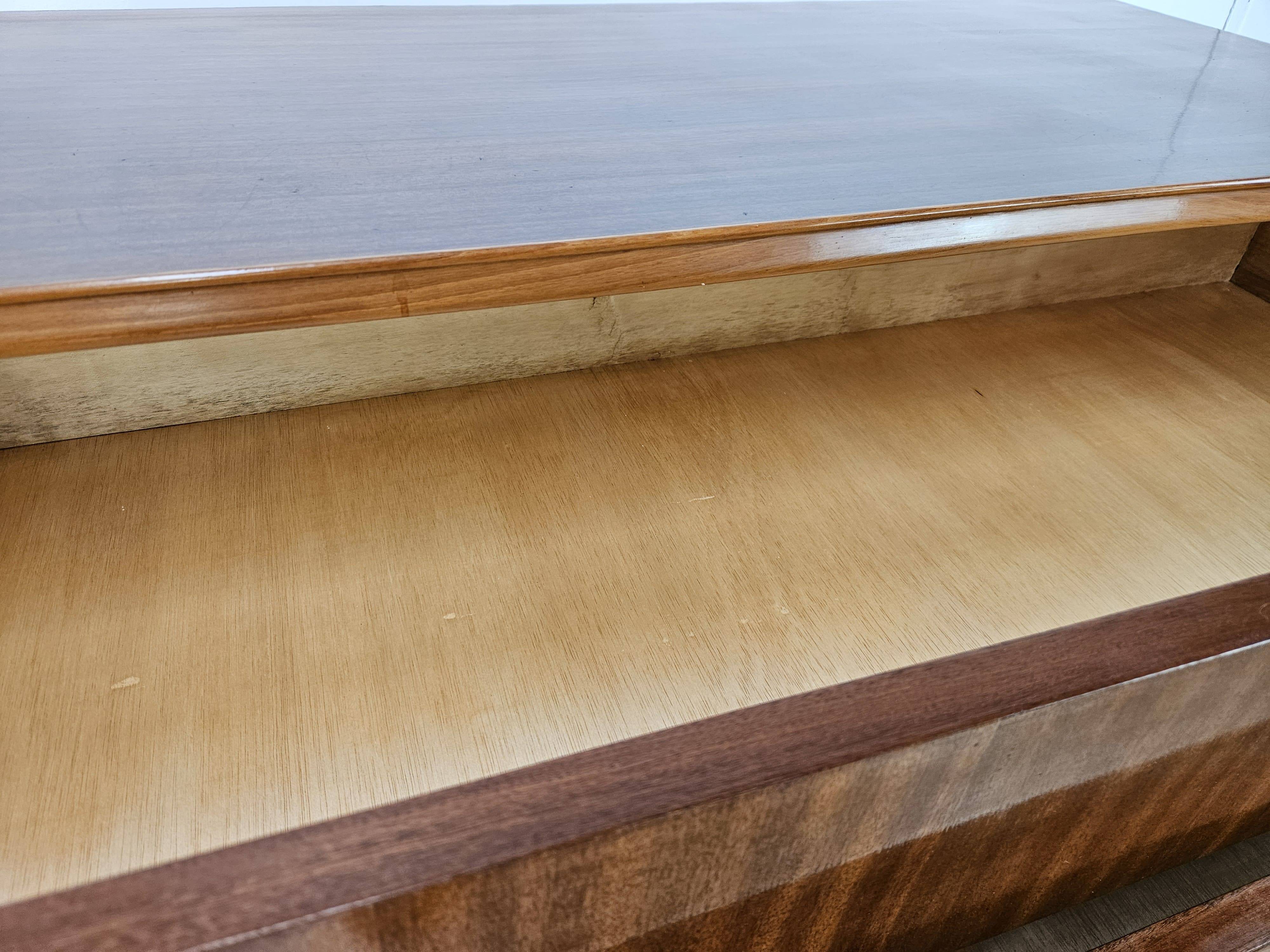 1950s chest of drawers covered in walnut with brass handles