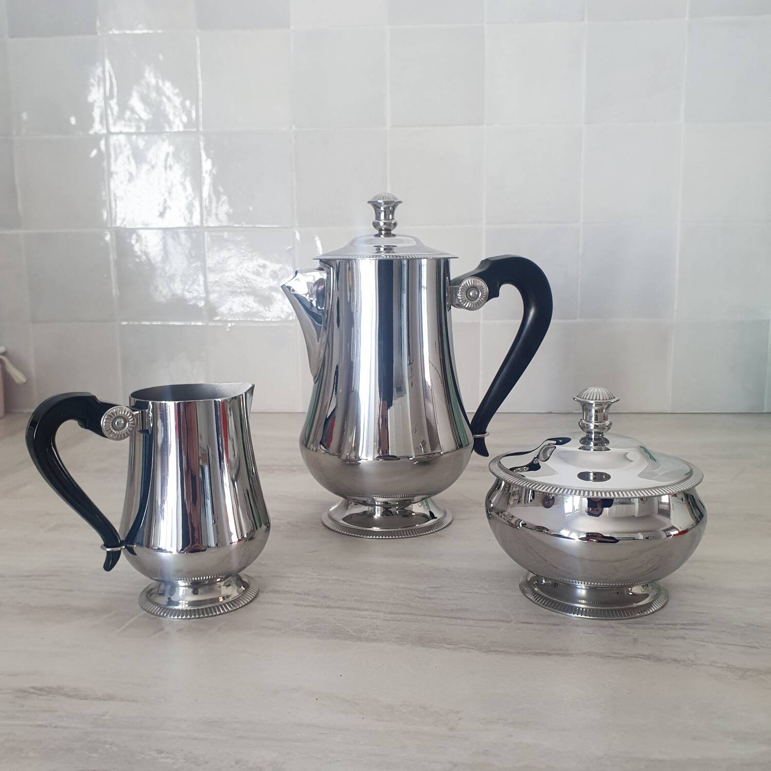 Rémy Letang / Teapot, milk jug and sugar bowl in 18/10 stainless steel and Bakelite